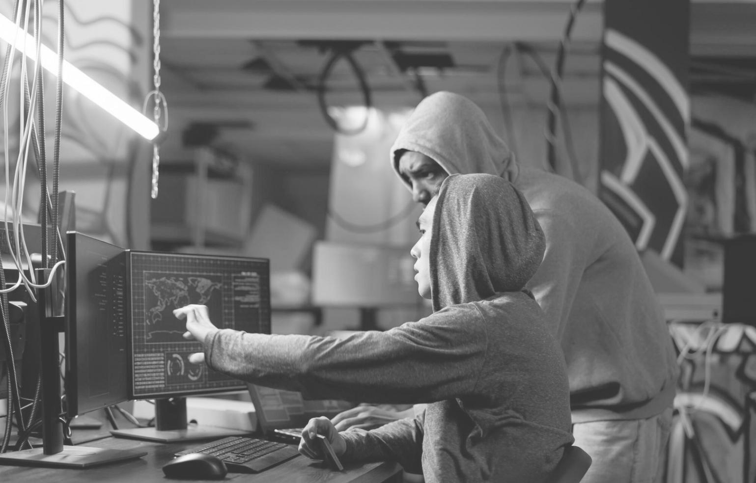 Designer reviewing user interface layouts and interaction patterns